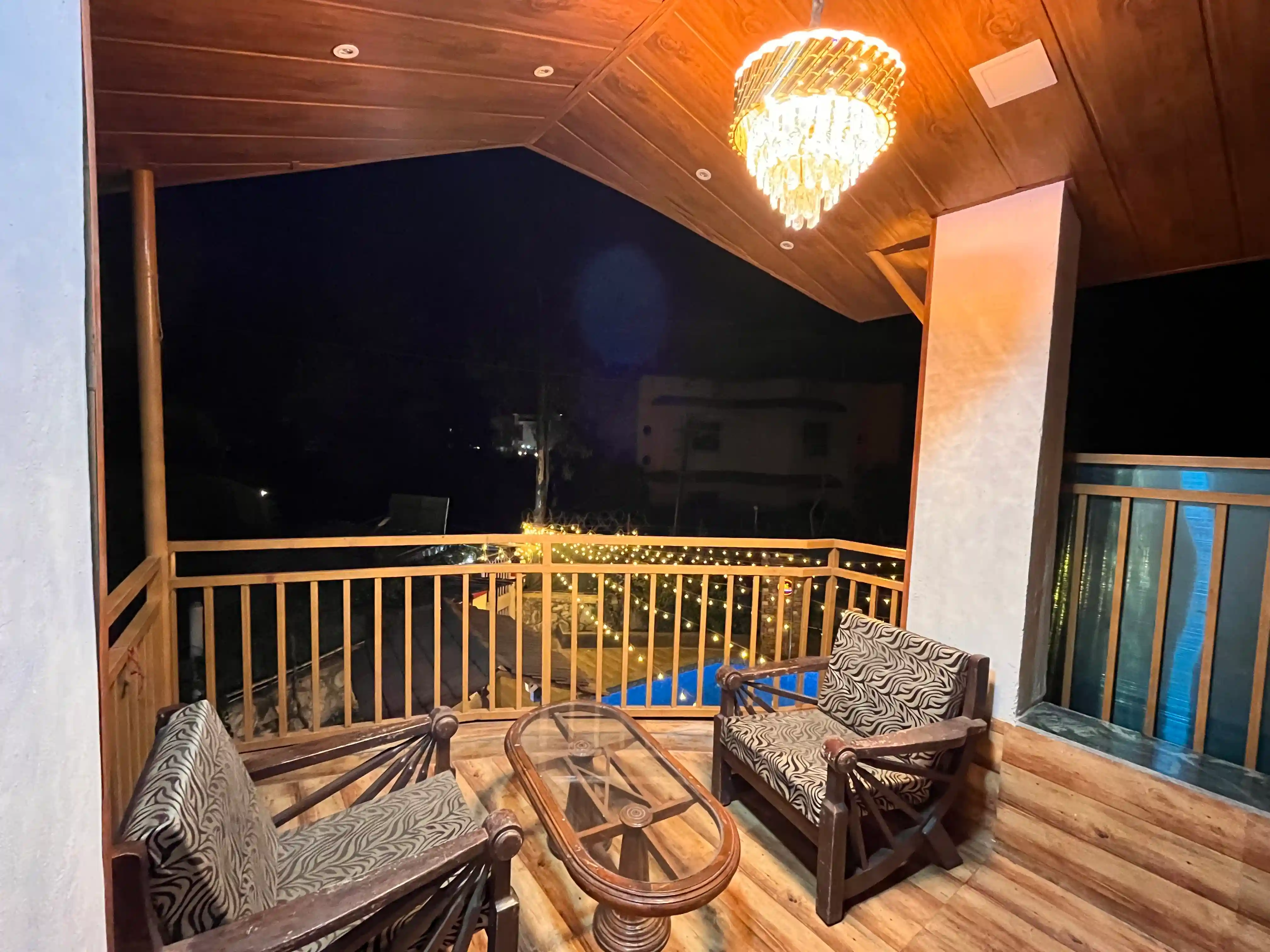 View of the Govind Villa balcony with a stunning pool view, ideal for relaxation and leisure.